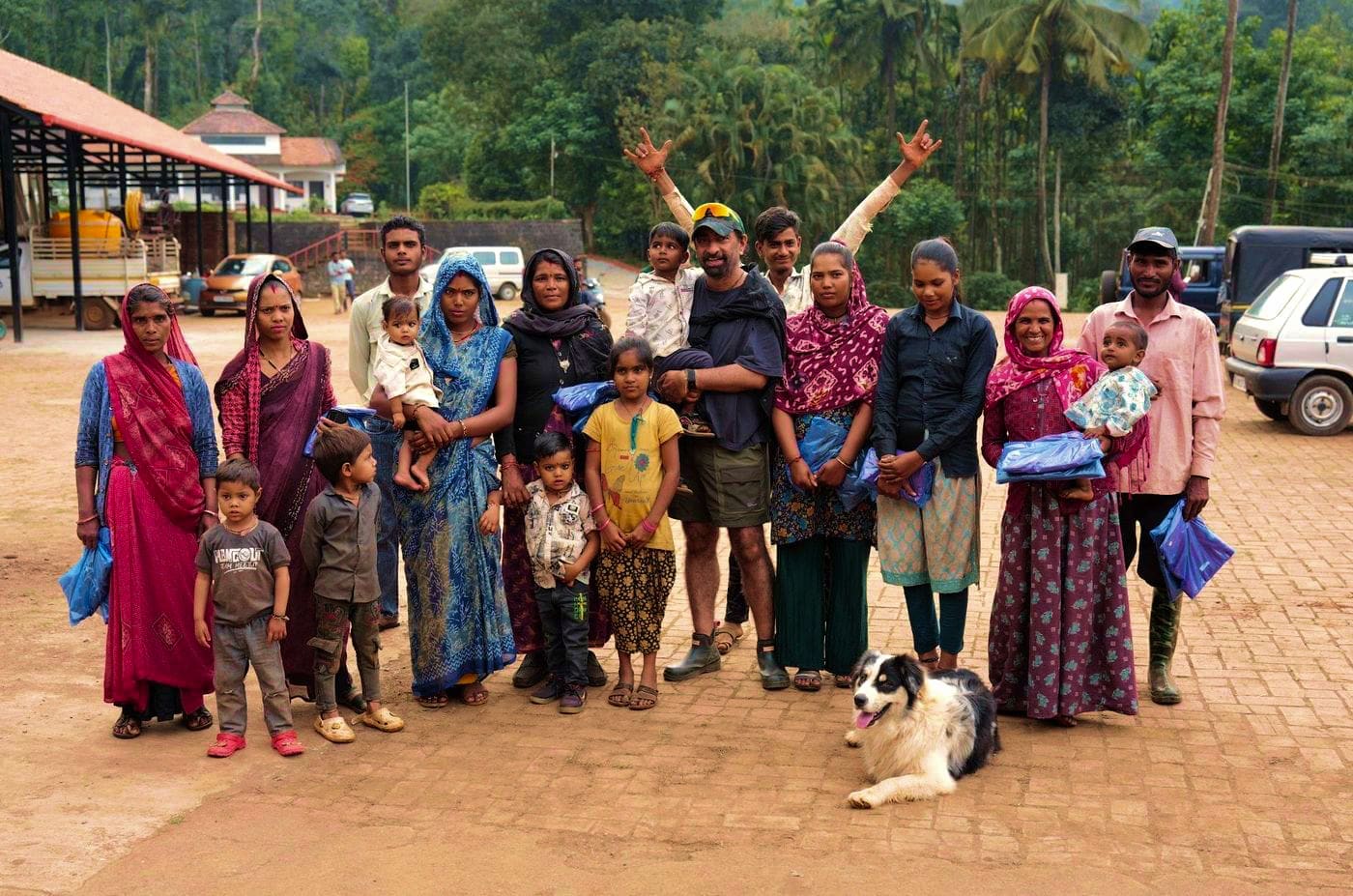 A group photograph of guests and the people of the estate