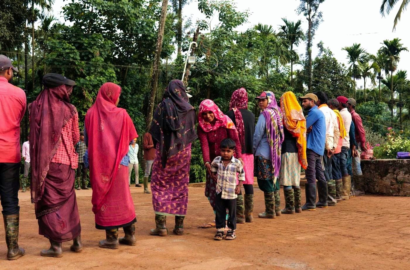 Women of the estate standing in a line, ready for the day