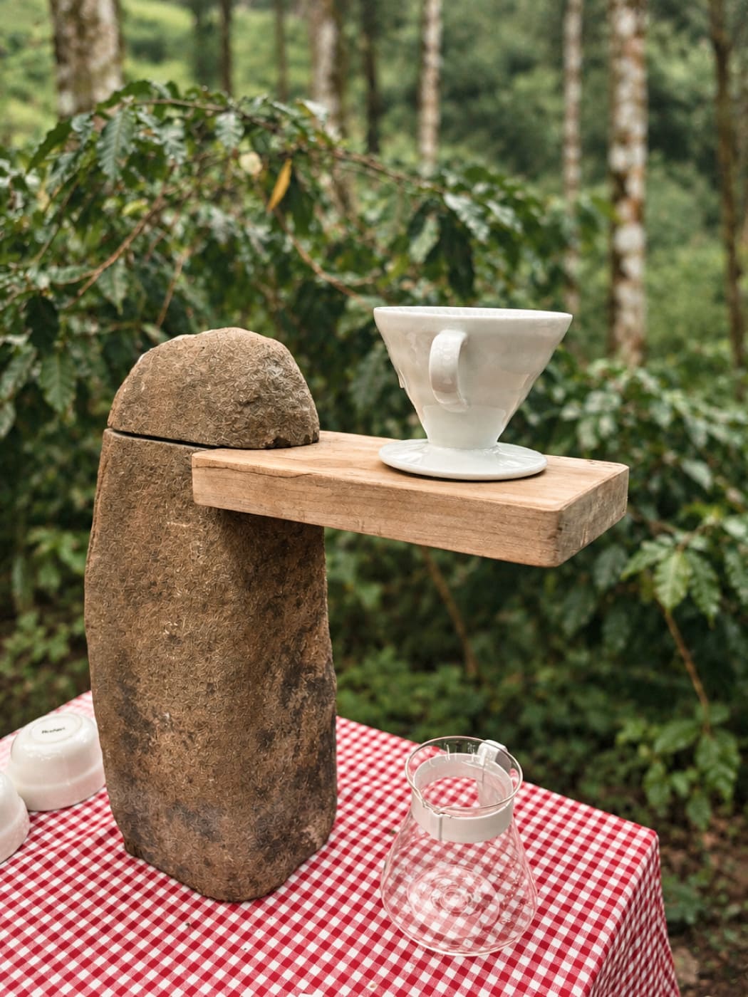 A pour-over dripper set on a standing stone