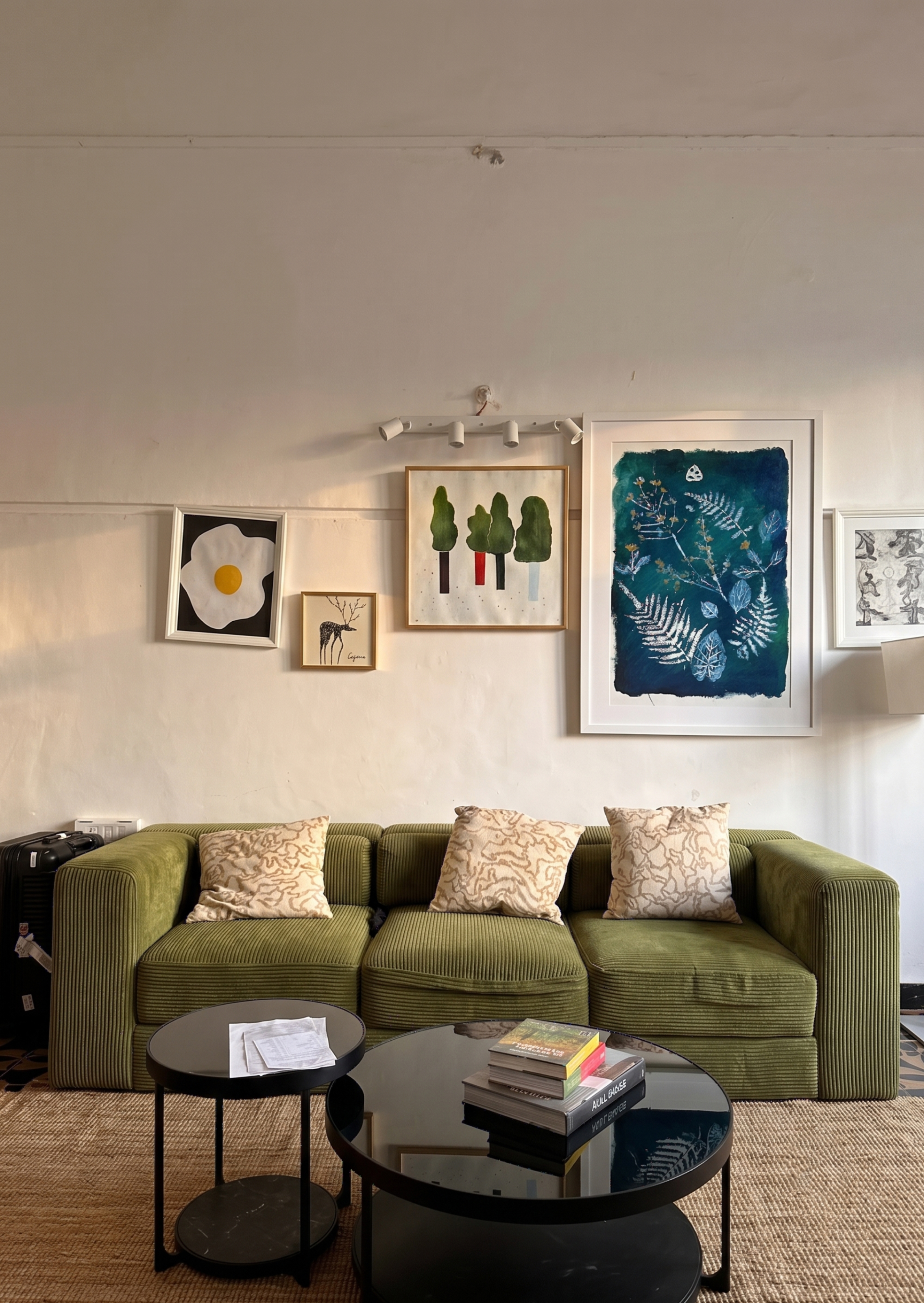 A gallery wall of framed botanical artwork at Ohara