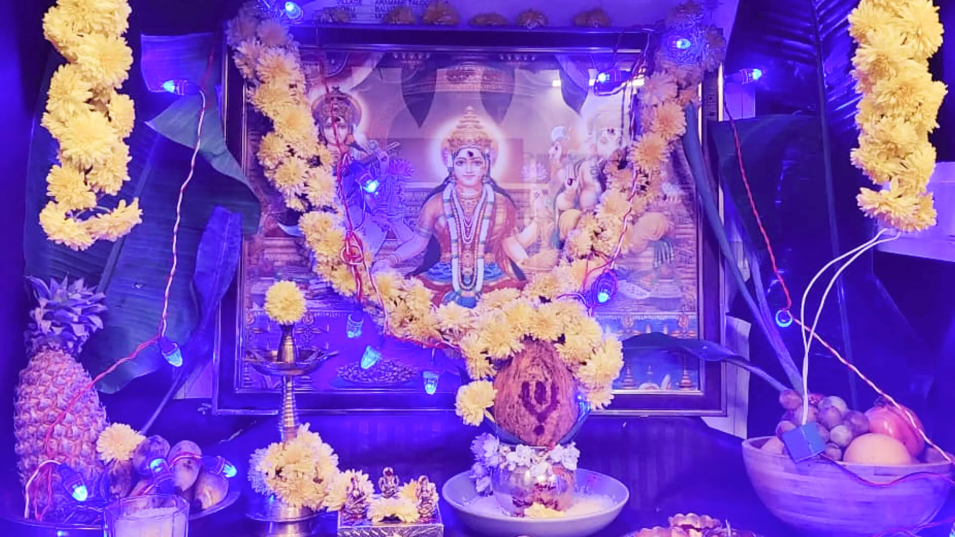 The shrine dressed with marigold garlands, banana leaf and lights